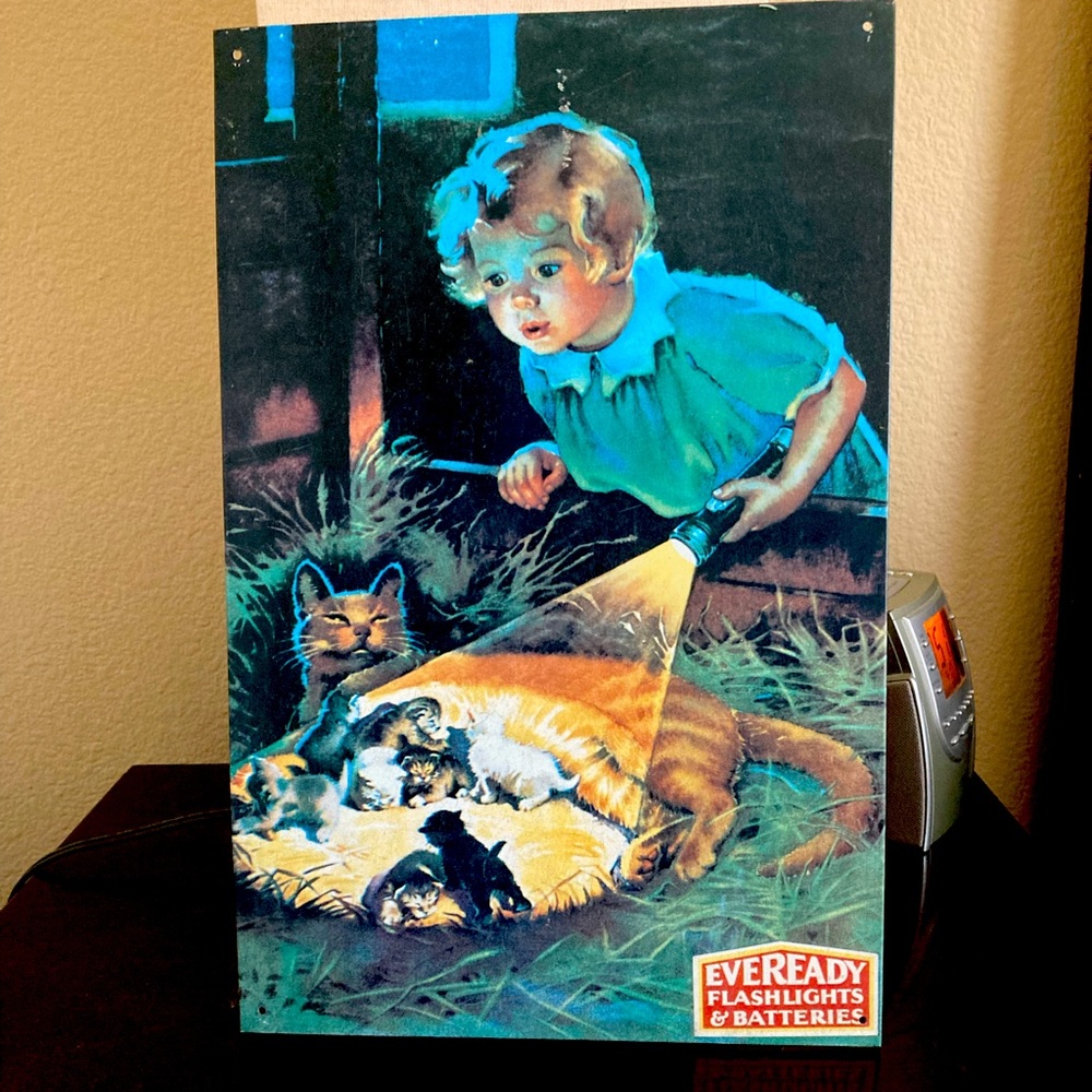 “Little Girl Discovers Cats,” Tin Advertisement - Eveready Battery Co.  (1993)